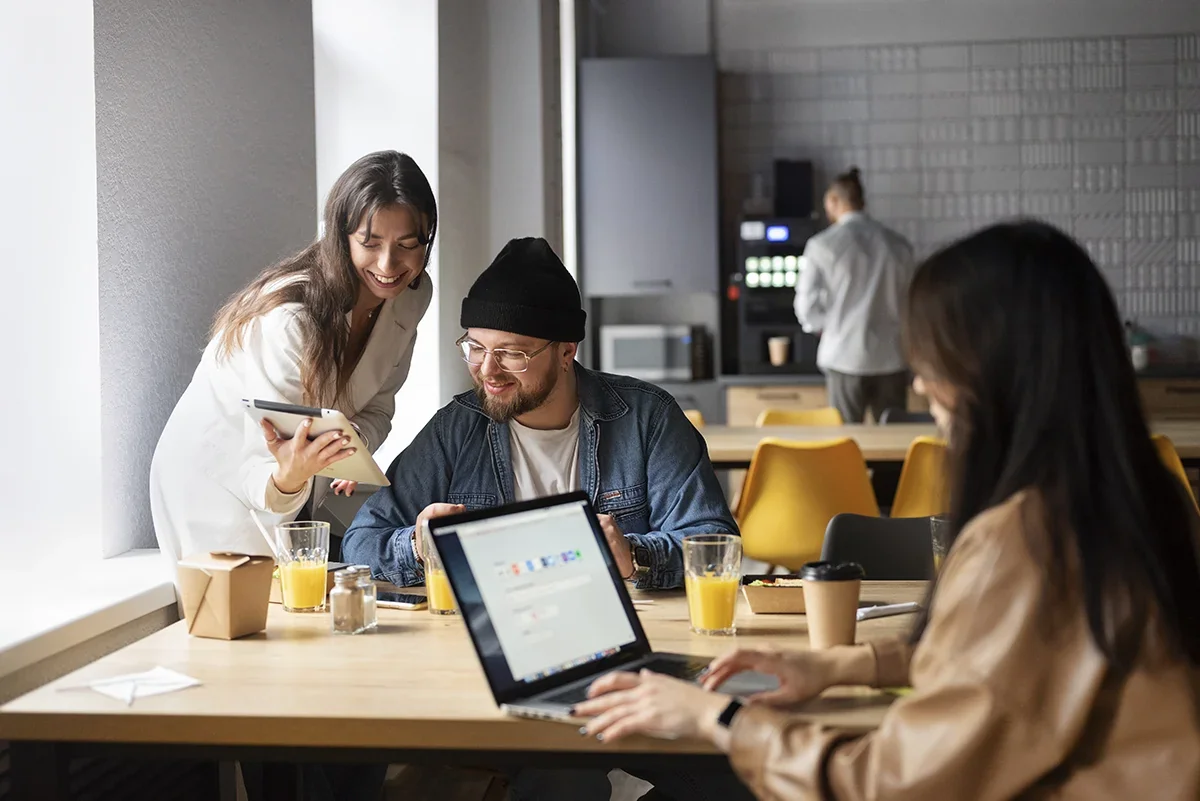 A team discussing web-based marketing strategies in a casual office setting.