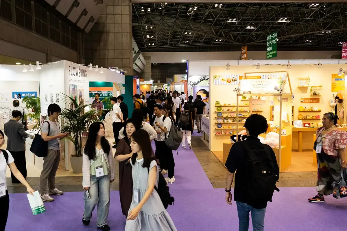 Corporate conference event with exhibitor booths, signage, and attendees