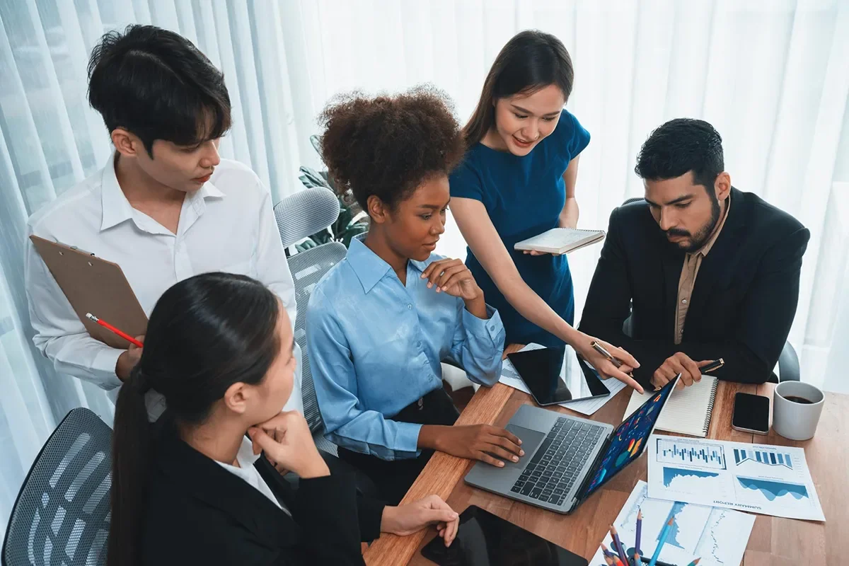 Event marketing team reviewing strategy and performance charts