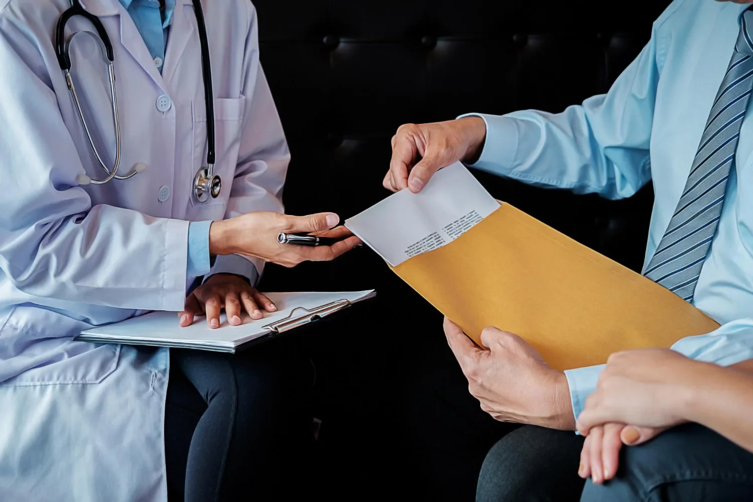 Healthcare provider reviewing a mailed patient document