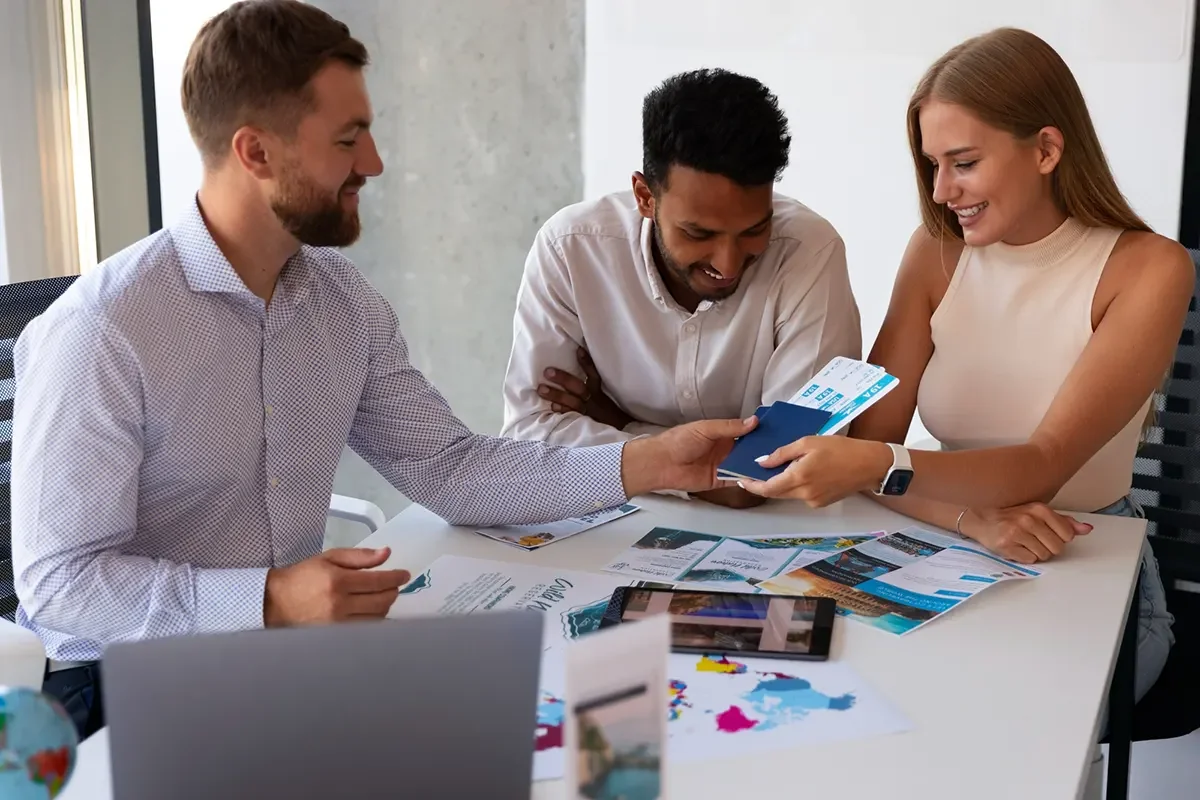 Marketing team reviewing branded materials while planning an event.